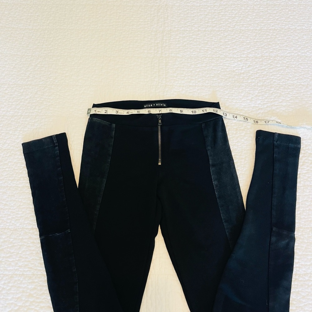 Alice + Olivia Black Jeggings with Stretchy Fit and leather straps on the side